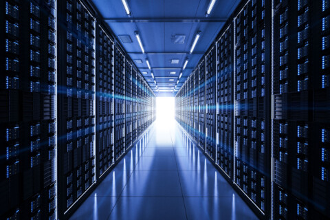 Dark server Room with light shining from the end of the hall